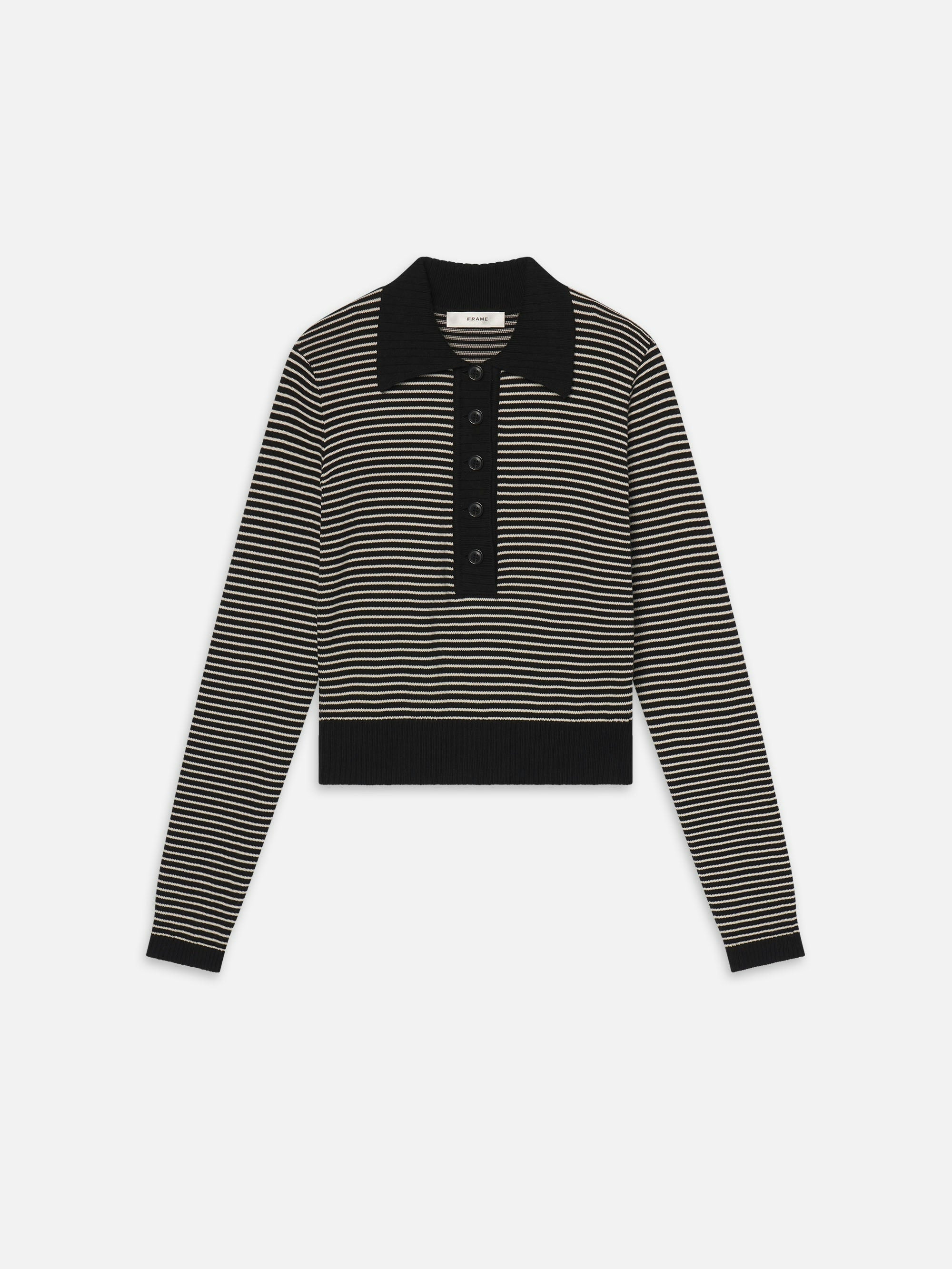 Black and white striped sweater with a collar on a white background