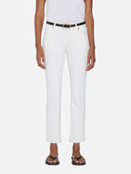 women wearing a pair of FRAME denim white jeans standing in front of a white background