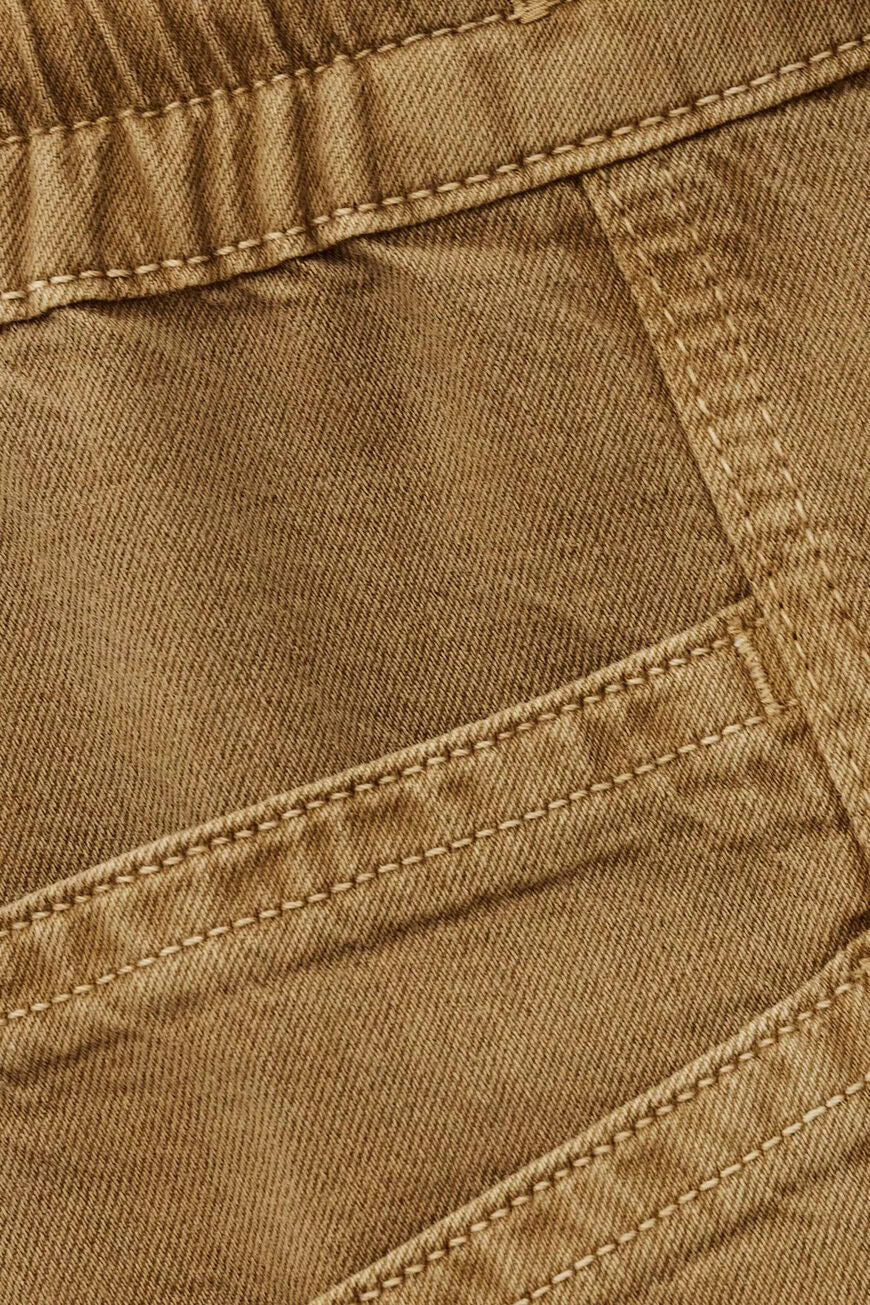 Close-up of brown fabric with stitching details