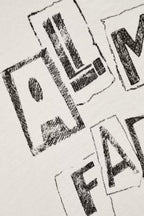 Black ink blots on a white background