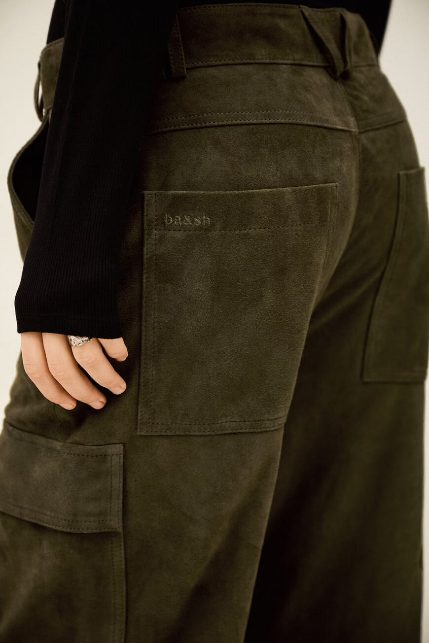 Brown cargo pants with a brand logo on the back pocket against a neutral background
