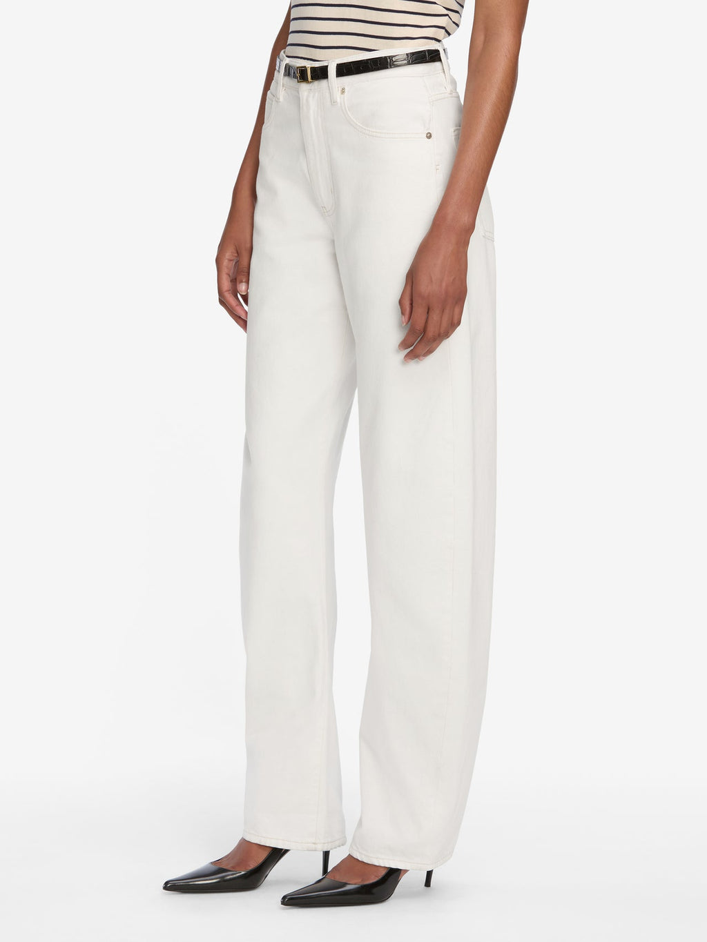 Person wearing white pants with a black belt on a white background