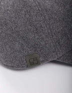 Gray cap with a brand logo on a white background