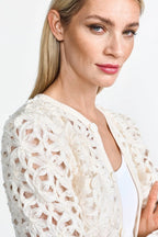 Woman wearing a rich and royal white lace cardigan against a plain background shop online muse boutique hawthorn