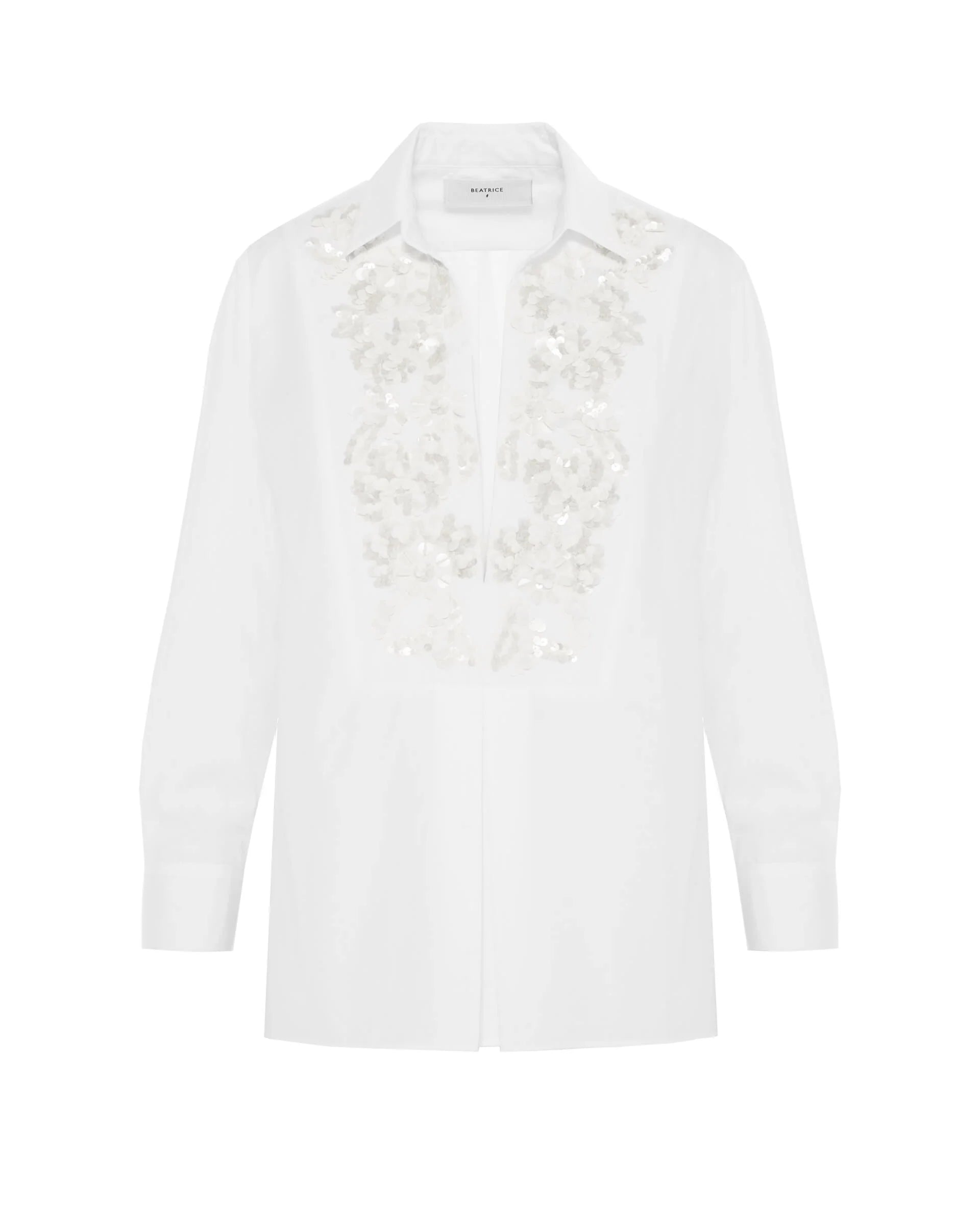 White blouse with lace detailing on a white background