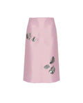 Pink skirt with floral embellishments on a white background