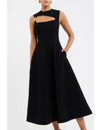 Black dress with cut-out details on a white background