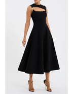 Black dress with cutout details on a white background