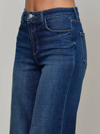 Close-up of blue jeans on a gray background