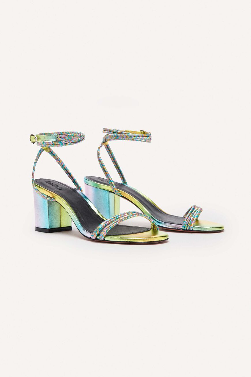 A pair of ba&sh Chiran sandals with block heels and adjustable ankle straps, featuring a multicolored metallic leather finish.