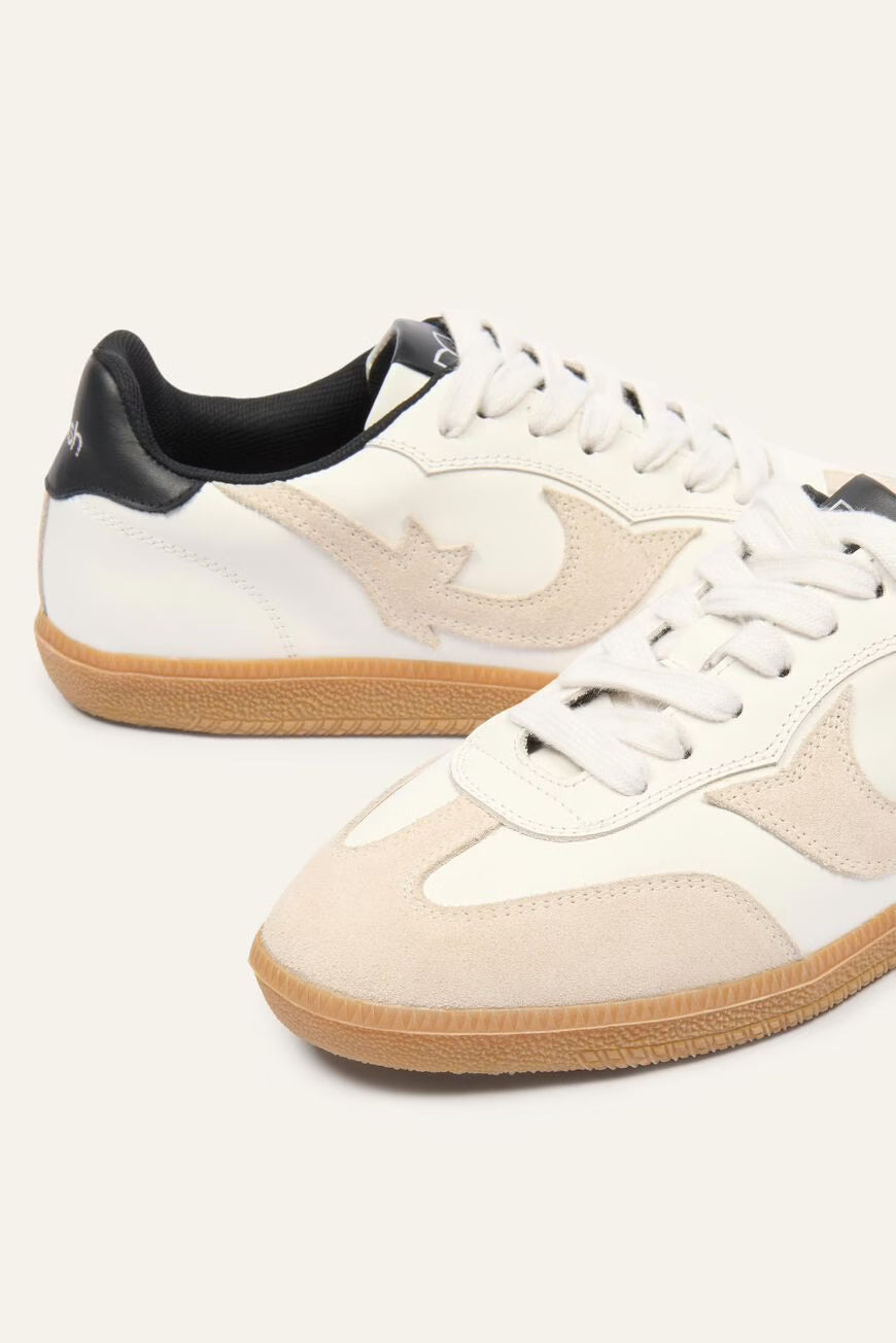 Pair of white and beige sneakers with brown soles on a white background