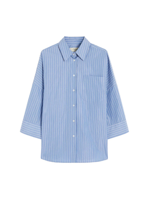 Blue and white striped shirt on a light gray background