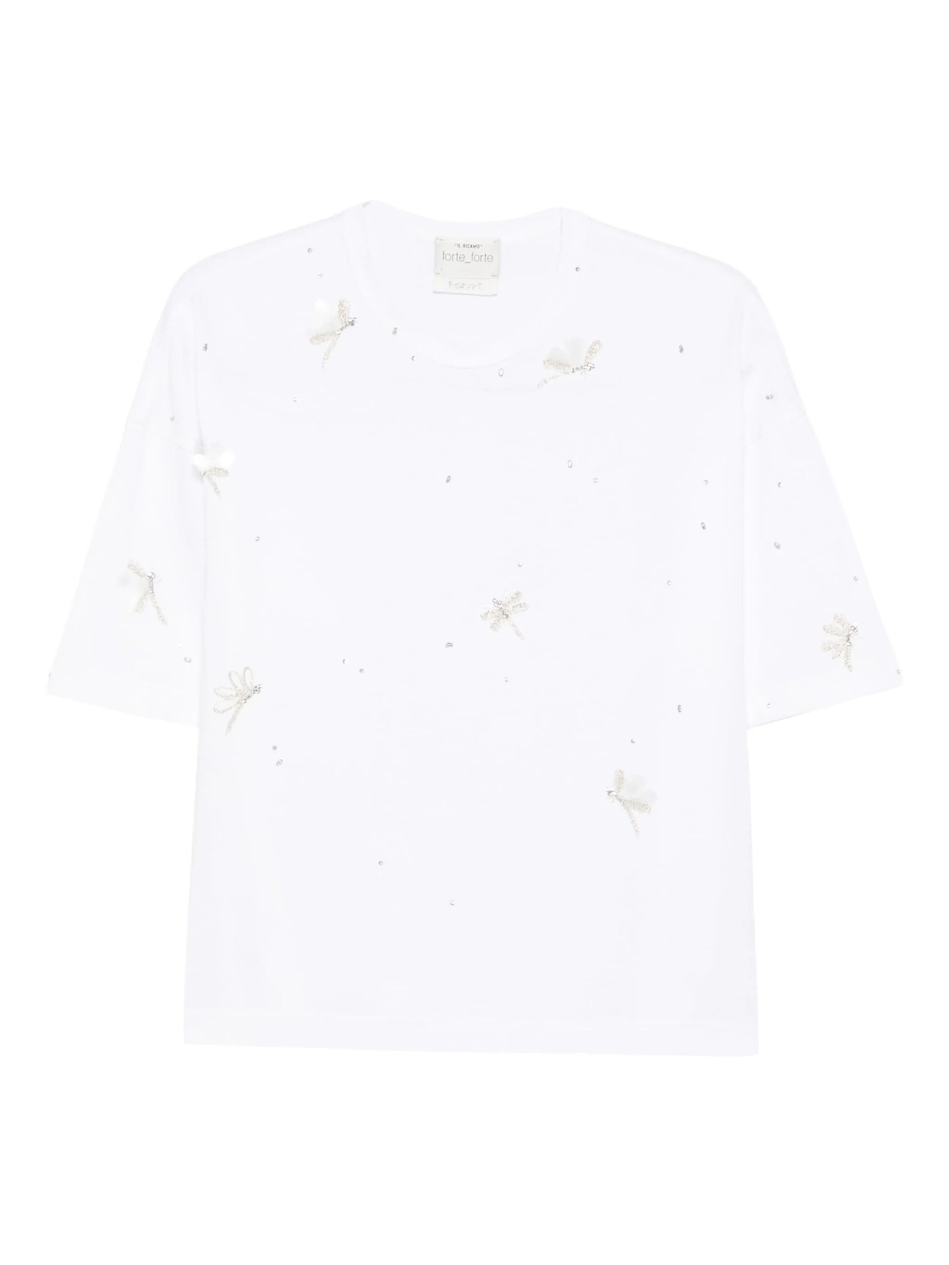 White t-shirt with small embroidered designs on a white background