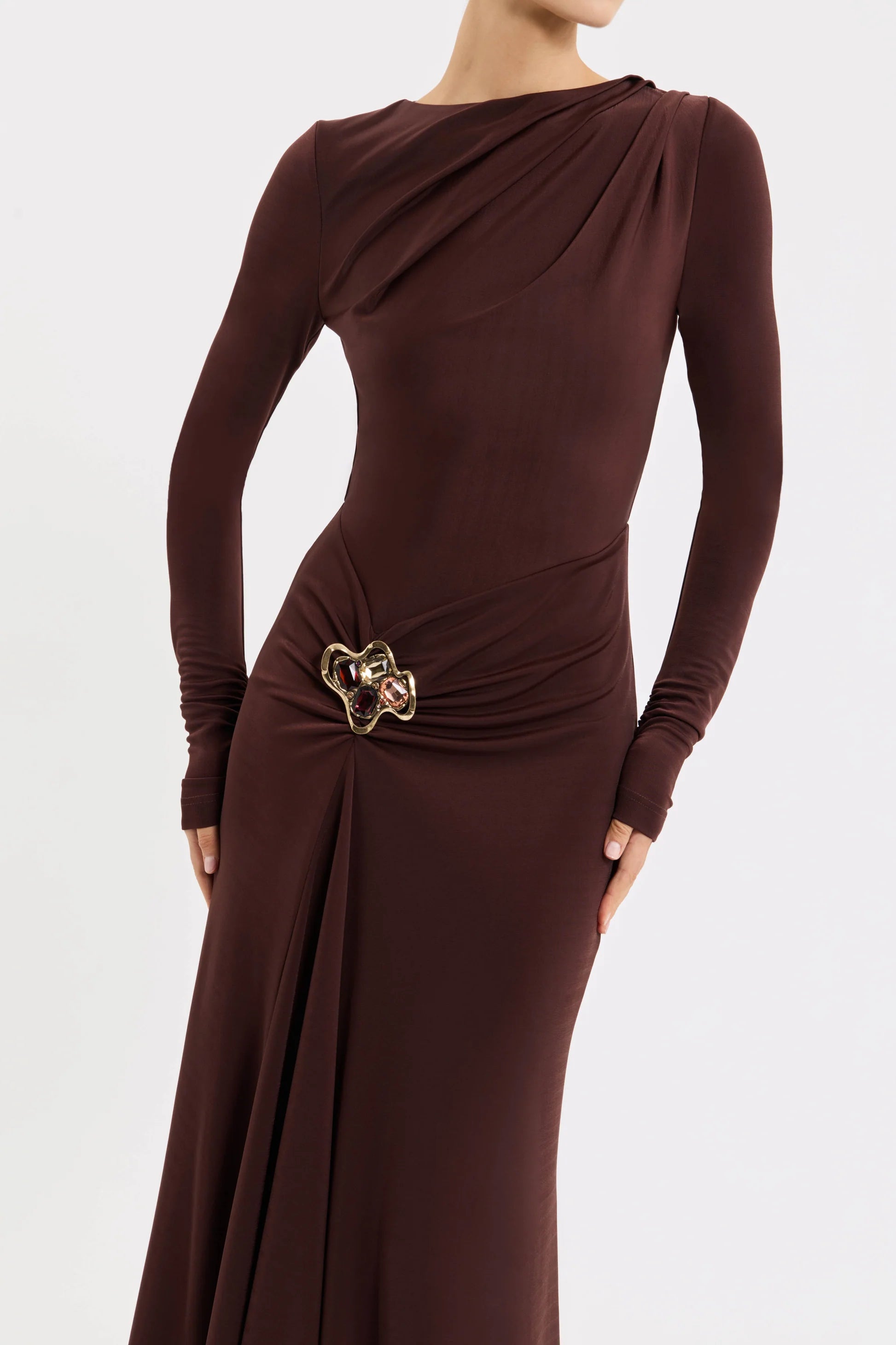 Brown evening gown with a belt on a white background