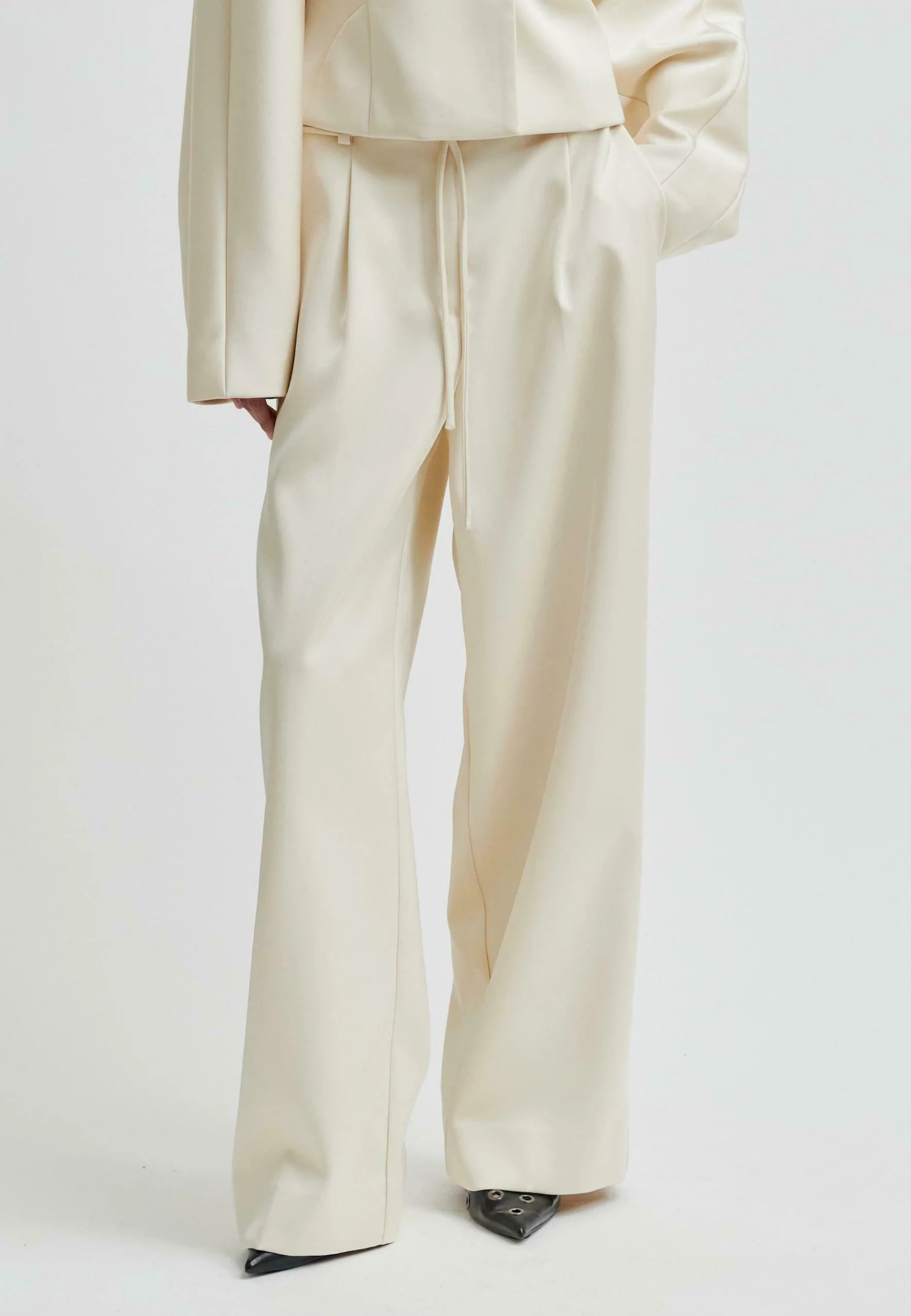 Beige suit with wide-leg pants on a white background