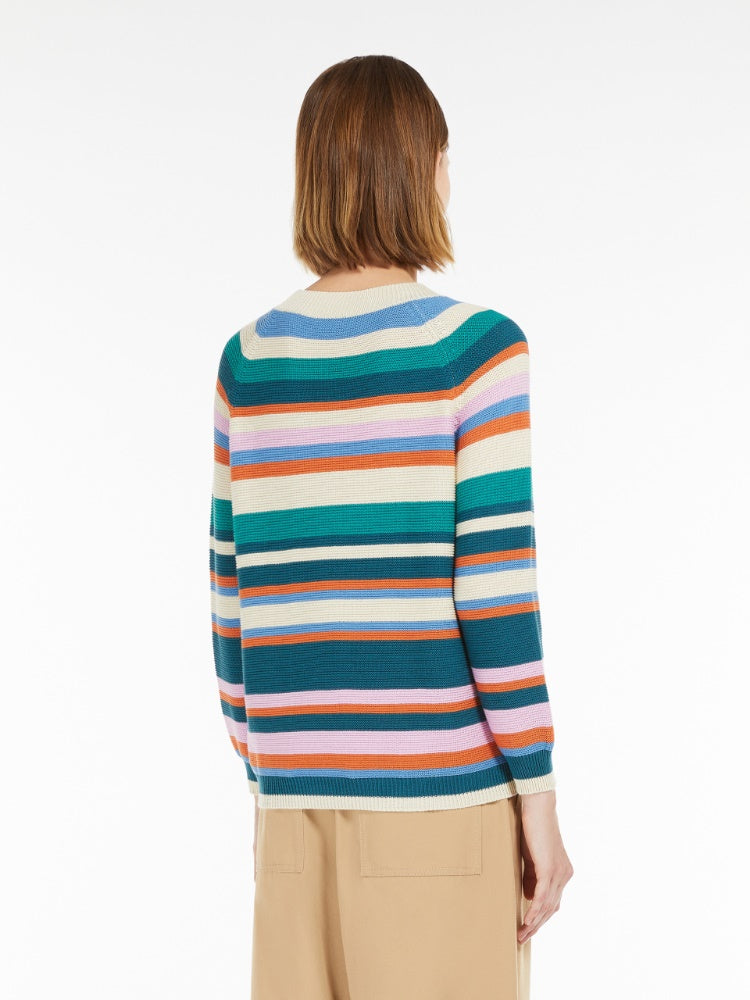 Person wearing a multicolored striped sweater on a white background