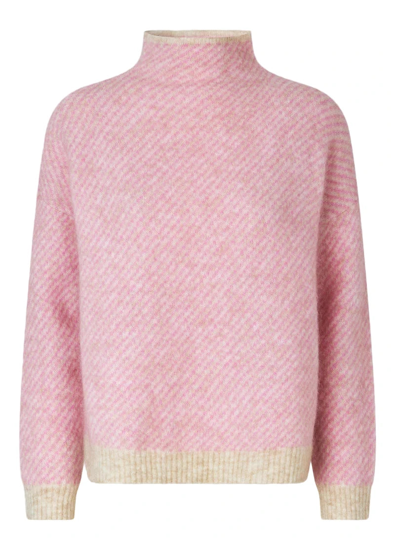 Pink textured sweater with a light border on a gray background
