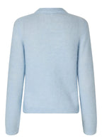 Light blue sweater on a light gray background