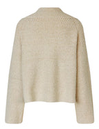 Beige knitted cardigan on a light gray background