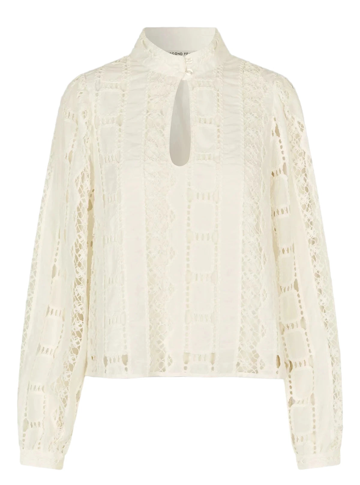 White lace blouse on a gray background