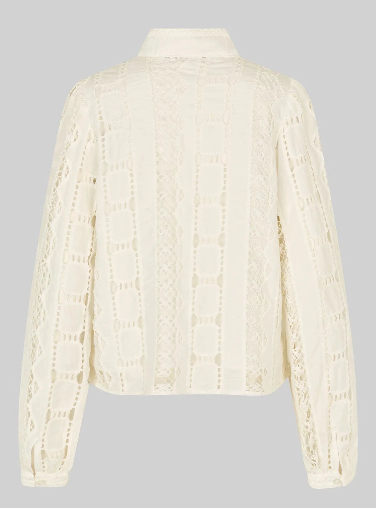 Cream-colored blouse with long sleeves on a gray background