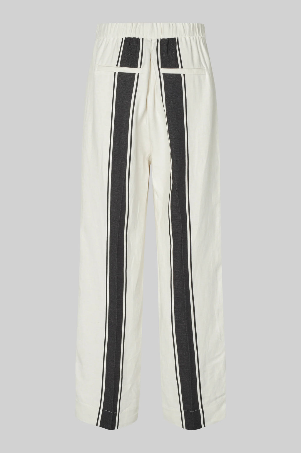 White pants with black stripes on a gray background