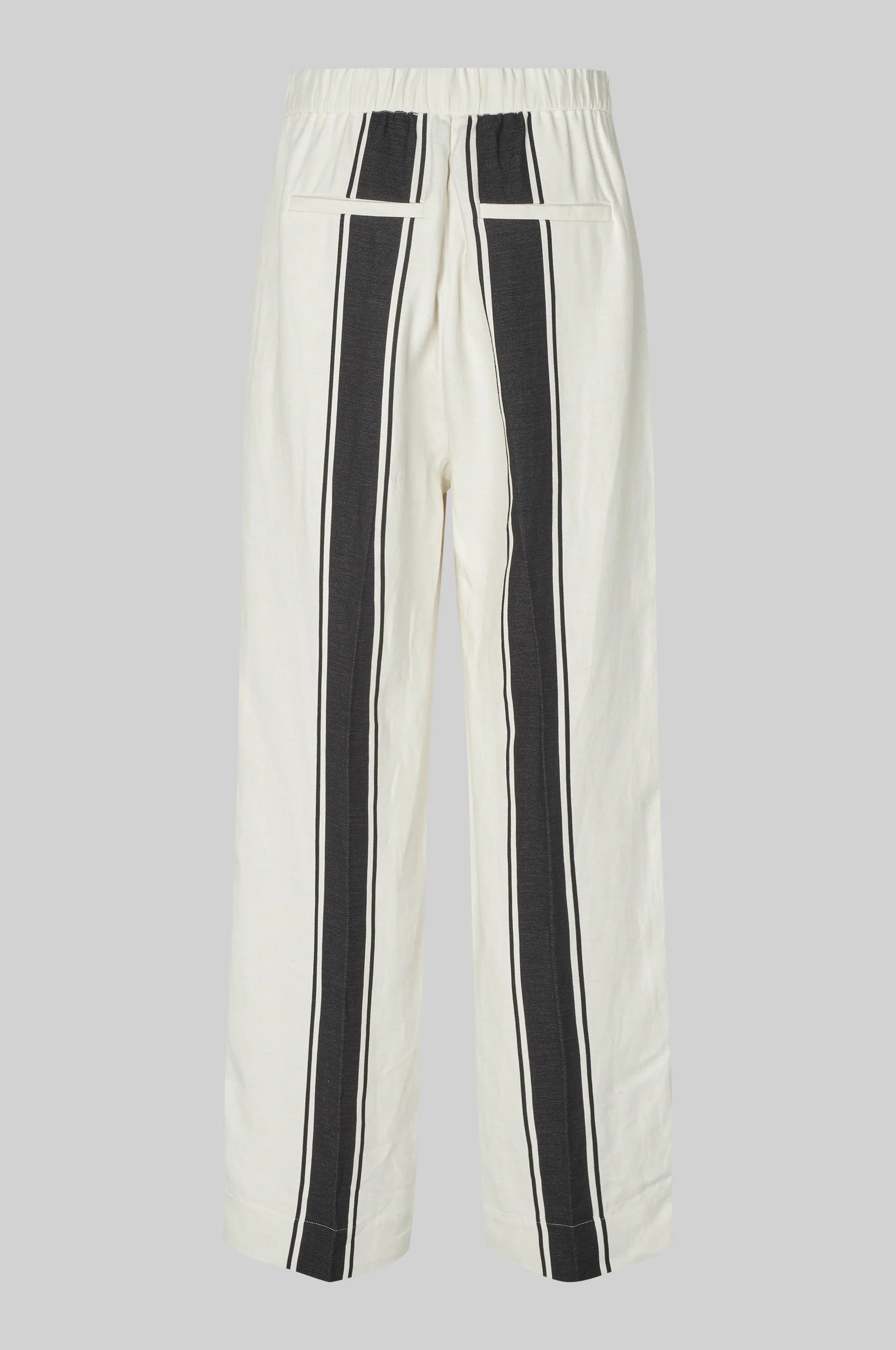 White pants with black stripes on a gray background