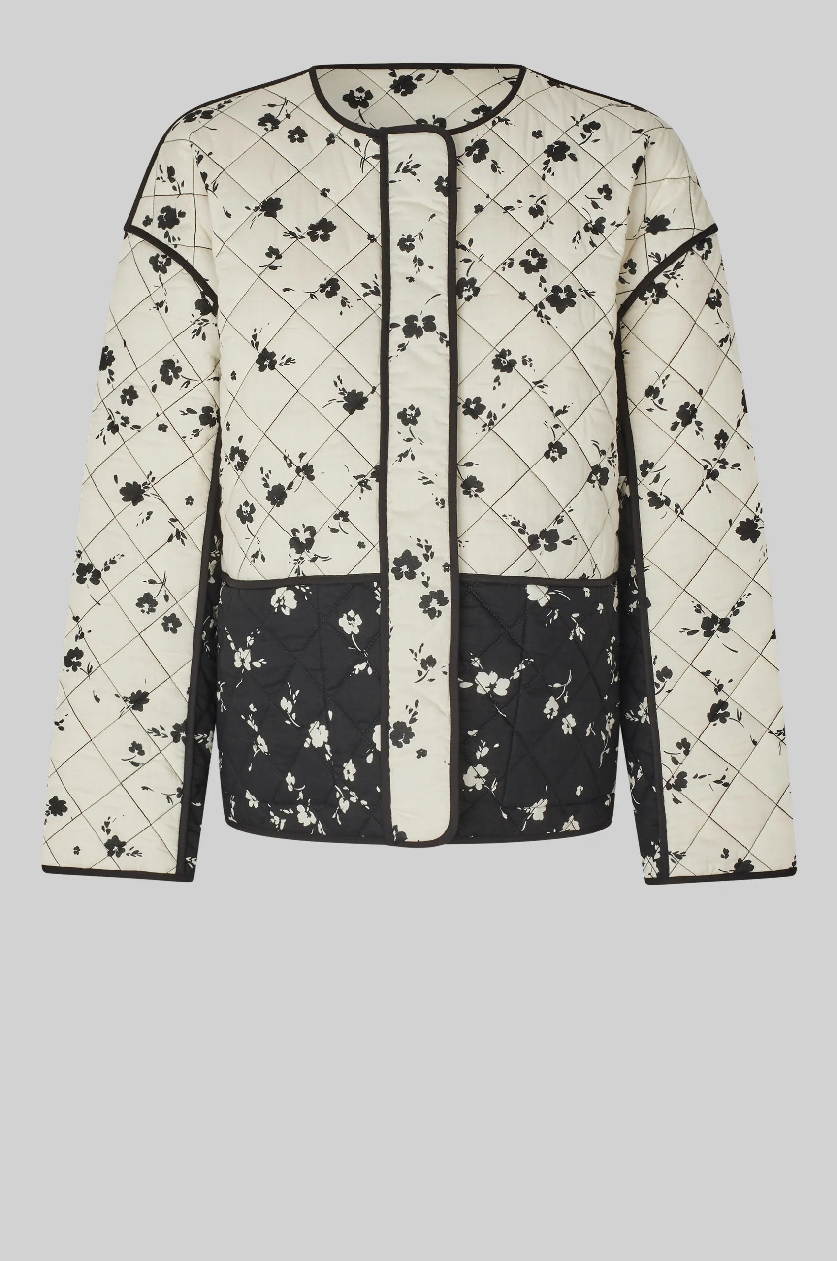 Black and white patterned jacket on a light gray background