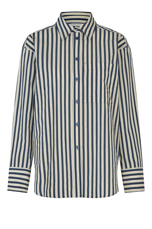 Navy and white striped shirt on a light gray background