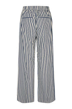 Navy and white striped pants on a light gray background