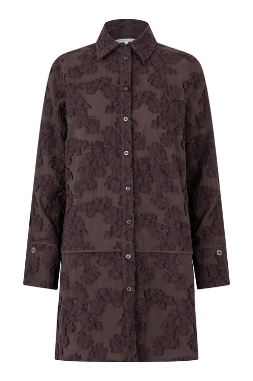 Brown floral patterned coat on a light gray background