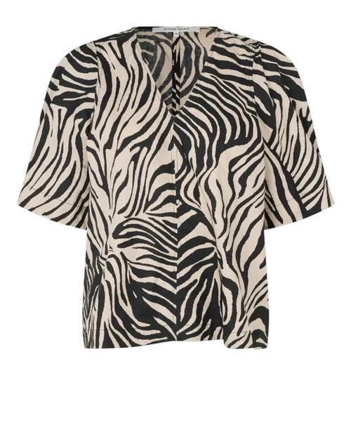 Zebra print top on a light gray background