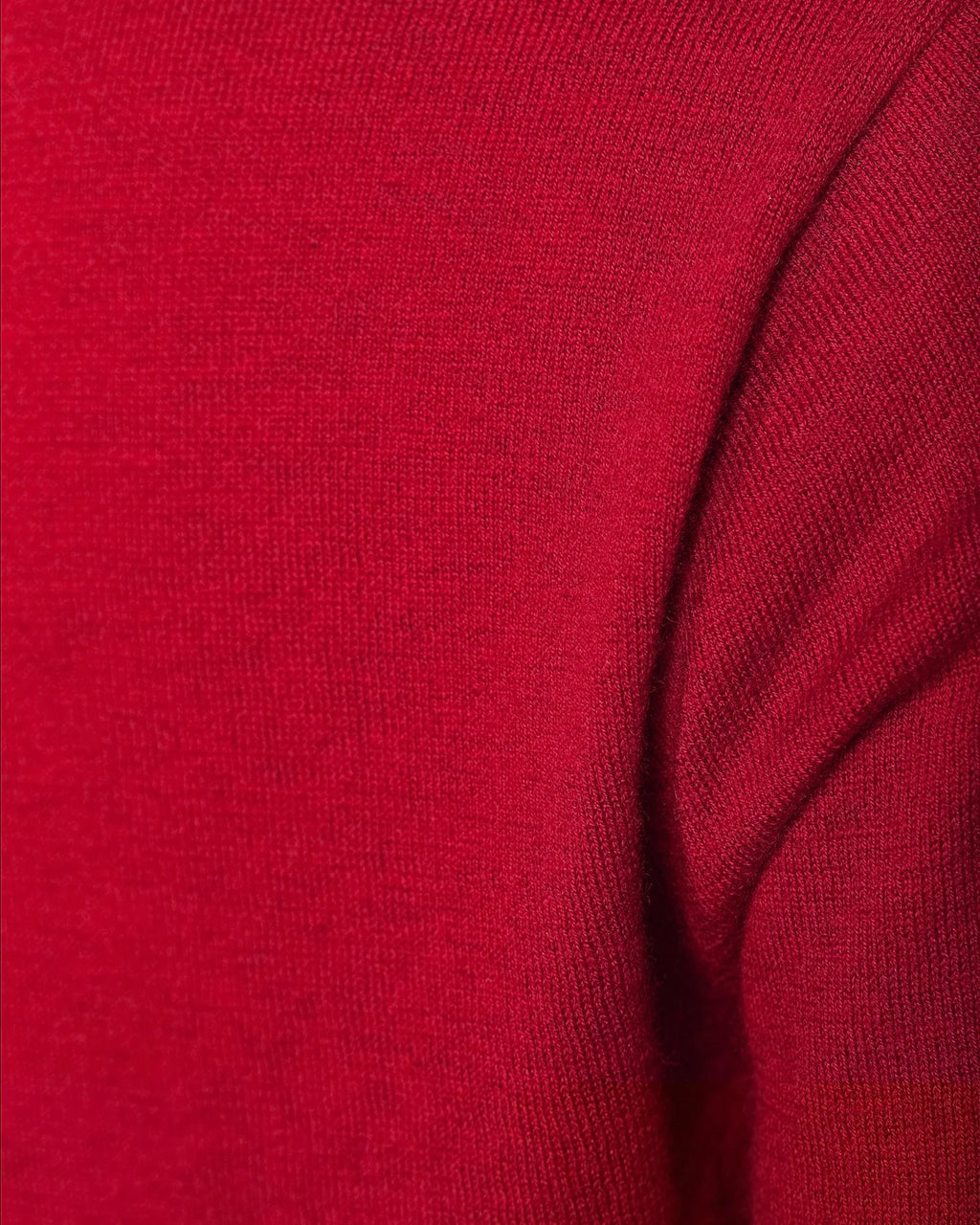 Close-up of a red sweater fabric texture