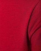 Close-up of a red sweater fabric texture