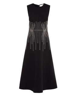 Black dress with silver geometric embroidery on a white background