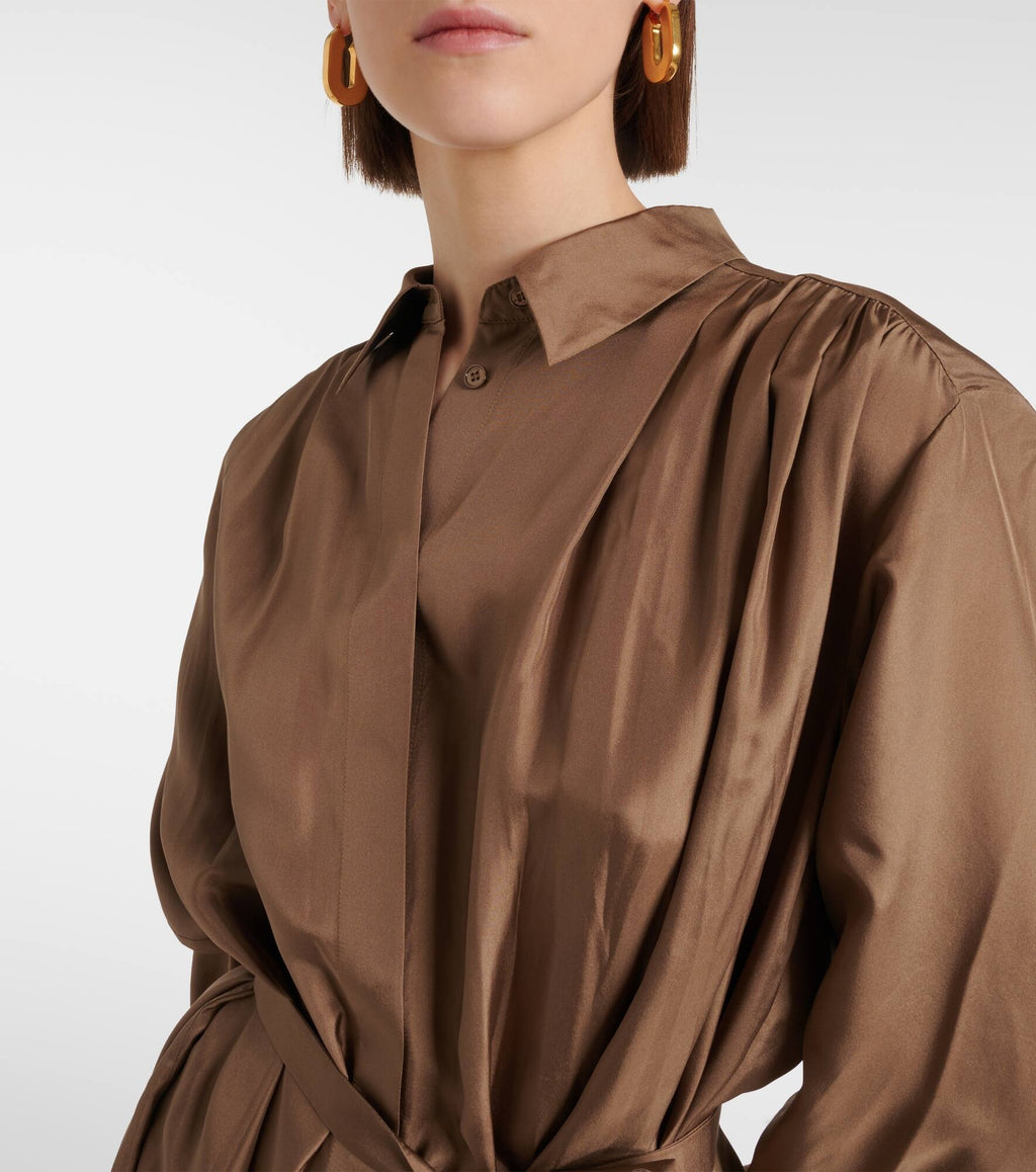 Brown dress worn by a person on a white background