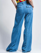 Blue jeans worn by a person on a white background