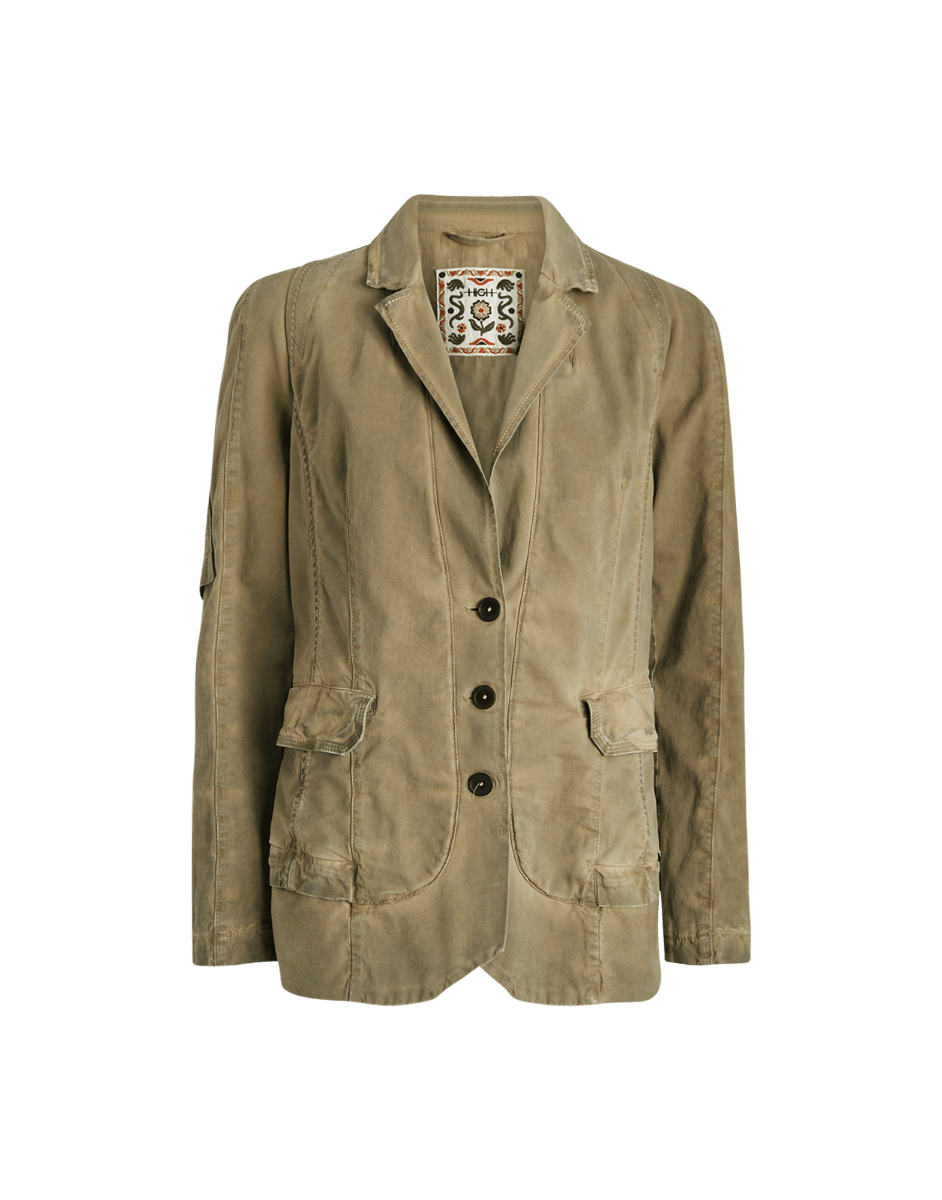 Brown jacket with decorative patch on a green background