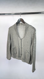Gray knitted cardigan on a hanger against a white background