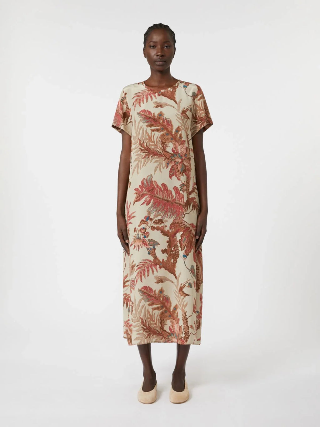 Woman wearing a floral dress on a white background