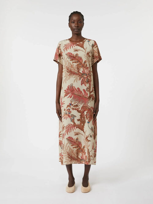 Woman wearing a floral dress on a white background