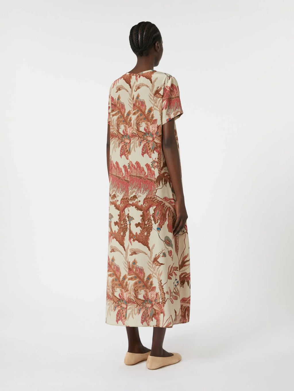 Woman wearing a floral dress on a white background