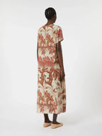 Woman wearing a floral dress on a white background
