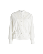 White shirt on a green background