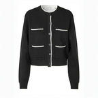 Black cardigan with white accents on a white background