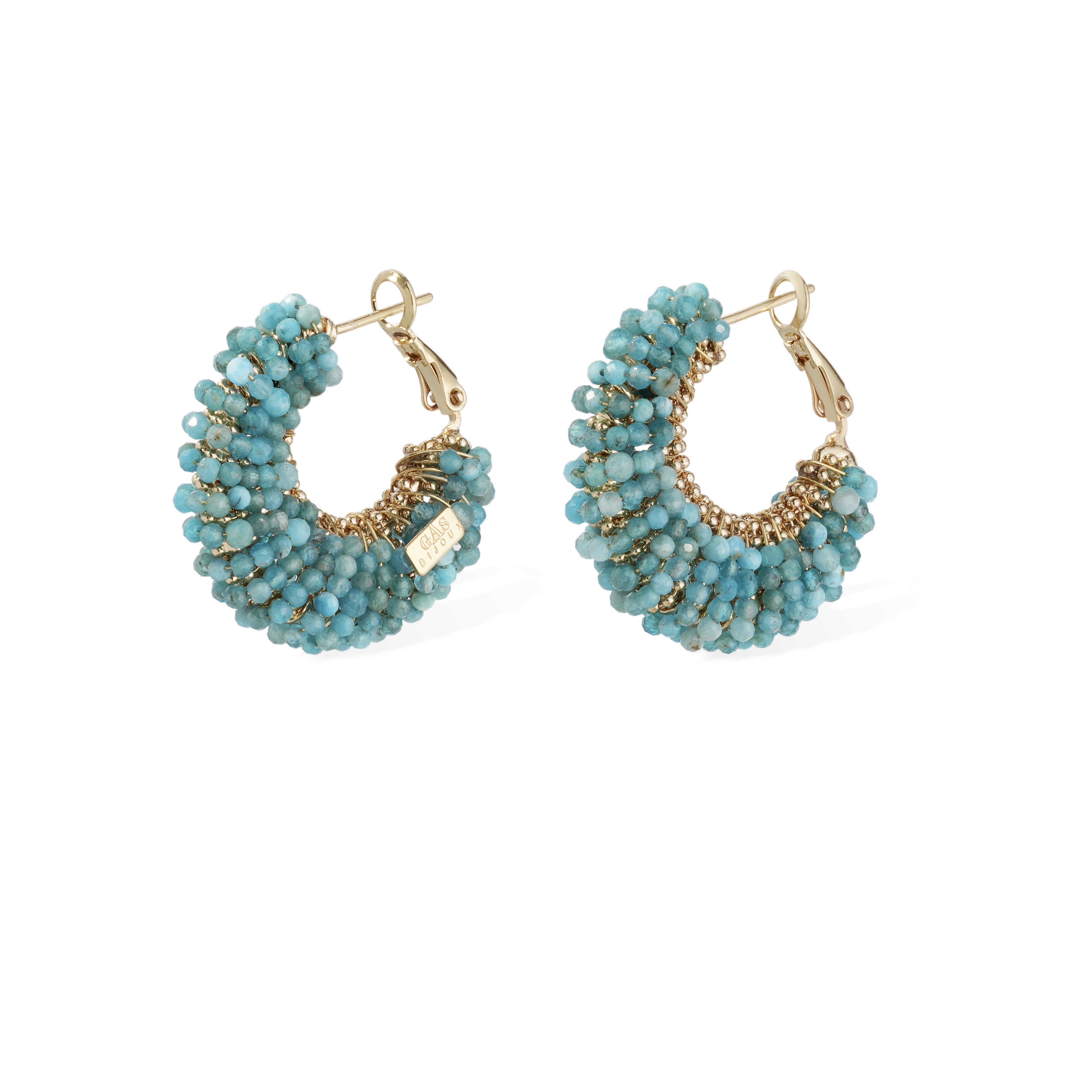 Pair of turquoise beaded hoop earrings with gold accents on a white background