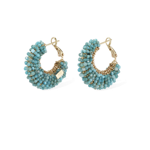 Pair of turquoise beaded hoop earrings with gold accents on a white background
