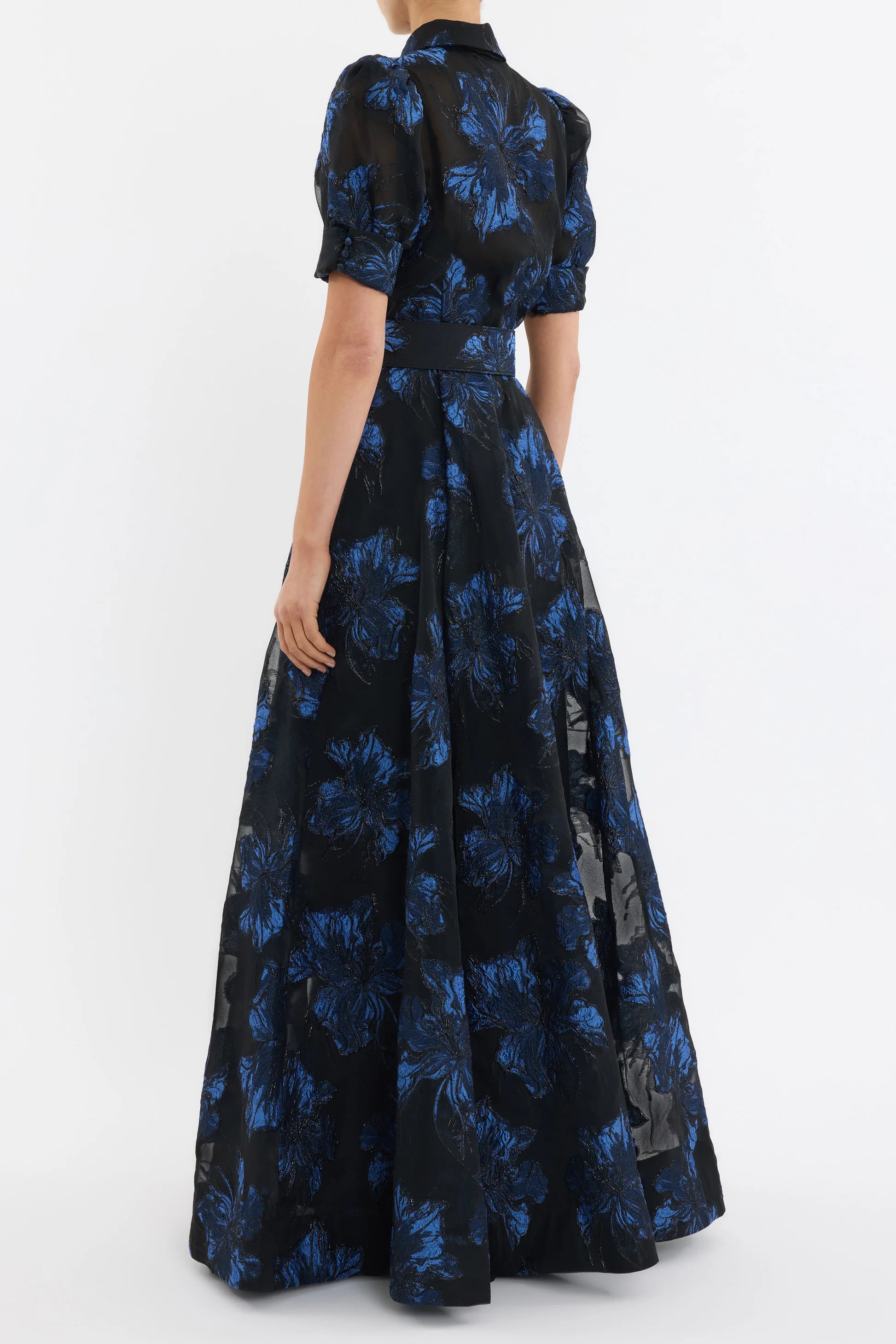 Black dress with blue floral pattern on a white background