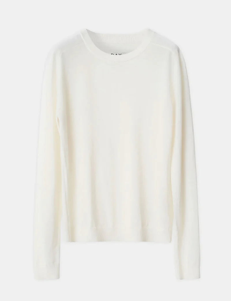 White sweater on a light gray background