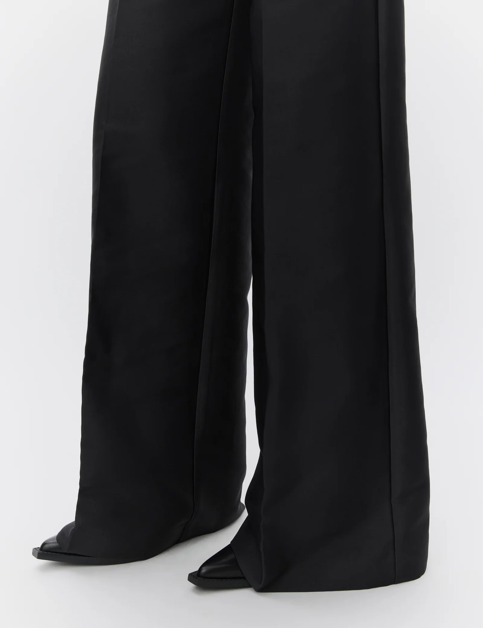 Black wide-leg pants on a white background